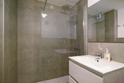 a bathroom with a sink and a shower at Casa Brando in Corralejo