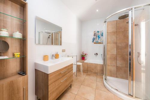 a bathroom with a sink and a shower at Cas Padri Teco in Ariany