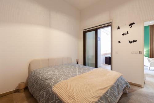 a bedroom with a bed with birds on the wall at Le Castel in Marseille