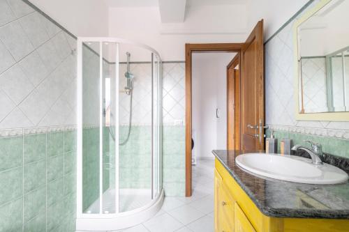 a bathroom with a shower and a sink at Casa Cuccureddu in Jerzu