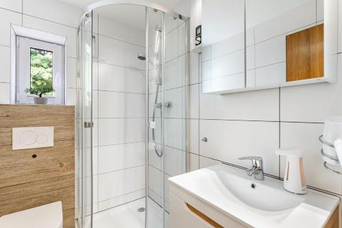 a bathroom with a sink and a shower at Perle am Pön in Medebach