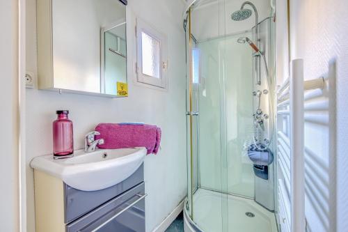 a bathroom with a sink and a shower at Sur La Route Des Vins - Libourne in Libourne