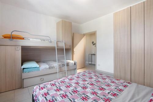 a bedroom with a bed and a bunk bed at Colico Center in Colico