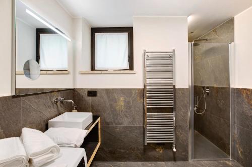 a bathroom with a sink and a shower at Valgrisa Mountain Lodges 3 in Valgrisenche