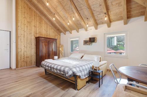 a bedroom with a bed and a wooden ceiling at Ca' Vittorio in Rossiglione
