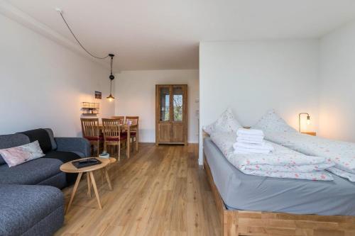 a living room with a couch and a table at Husbyries Wohnung 11 in Husby