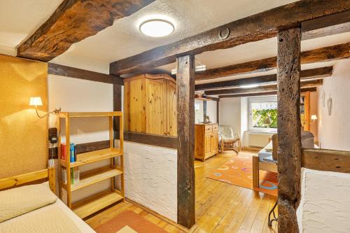 a bedroom with bunk beds and a room with a desk at Ferienhaus Neuenrade in Neuenrade