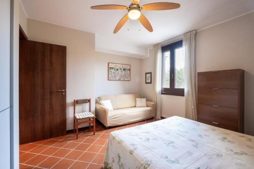 a bedroom with a bed and a ceiling fan at Casa Cenate Due in Nardò