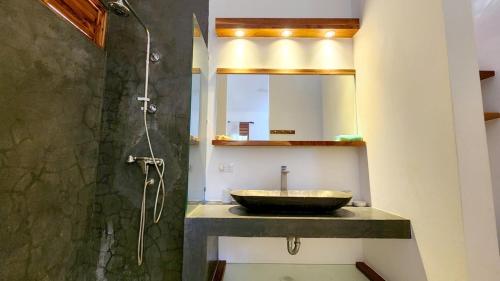 a bathroom with a sink and a shower at Casa Lowen Villa with Private Pool in Las Terrenas