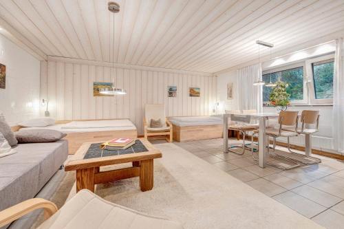a living room with a couch and a table at Haus Erna am Deister Apartment in Barsinghausen