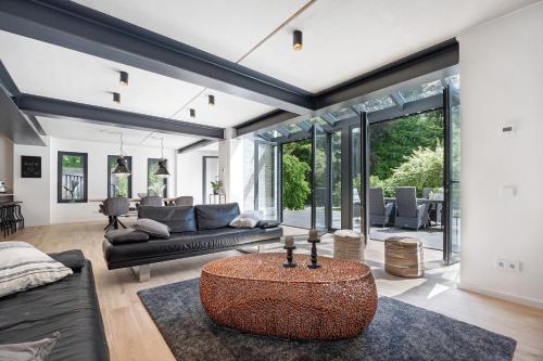 a living room with a couch and a table at Studio mt nine in Neu Wulmstorf