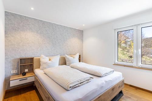 a bedroom with two beds and a window at Ferienhaus Wiese in Schmallenberg