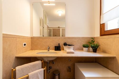 a bathroom with a sink and a mirror at Al Castagneto Foresteria Lombarda in Montevecchia