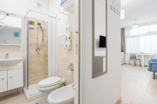 a bathroom with a toilet and a shower and a sink at Studio Flat Blu Palermo Mondello in Palermo