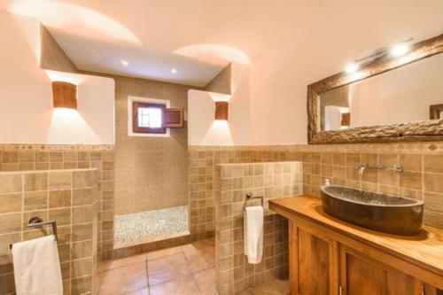 a bathroom with a sink and a mirror at Villa Dalt S Era in Santa Gertrudis de Fruitera
