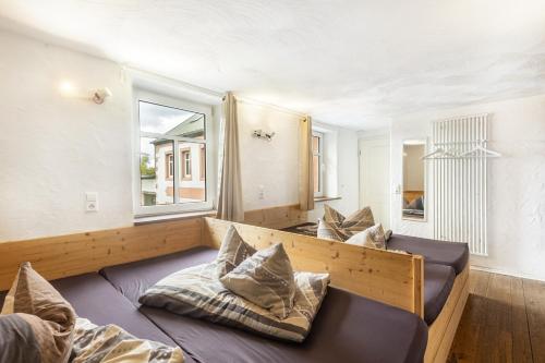 a room with two beds and a window at Ferienhaus Rodershausen in Rodershausen