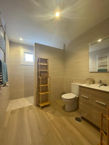 a bathroom with a toilet and a sink at Villa Gracia in Mijas