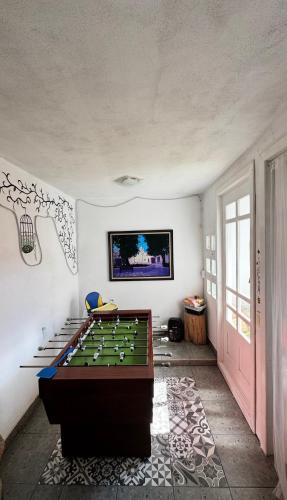 a room with a foosball table in the middle at Casa Bella Vizcaína in Mineral de Pozos