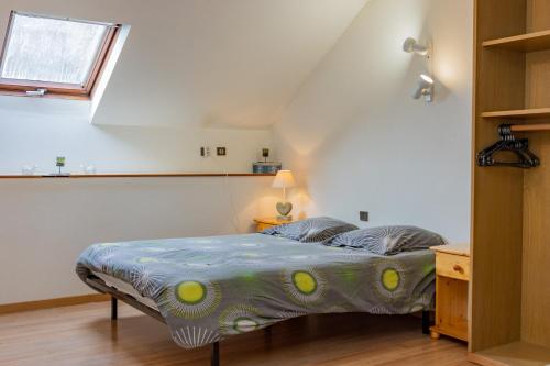 a bedroom with a bed in a attic at La résidence du vieux four in Saint-Geniès