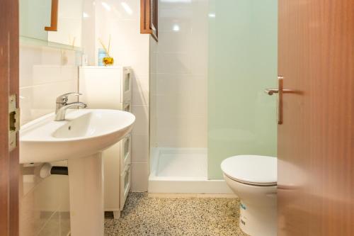 a bathroom with a sink and a toilet at Can Lopits in L'Escala