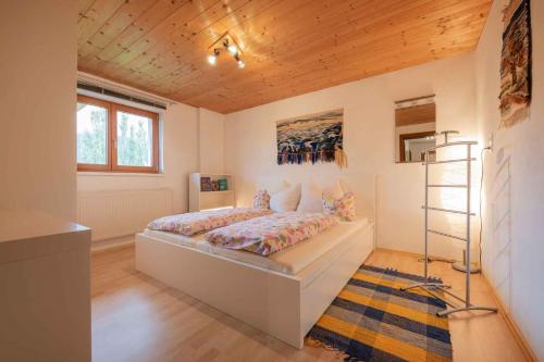 a bedroom with a bed and a ladder in it at Ferienwohnung Serlesblick in Mieders
