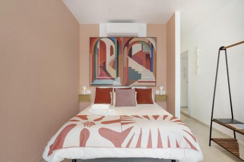 a bedroom with a bed and two mirrors at Apartamento The Stairs 2 11 in Tarifa