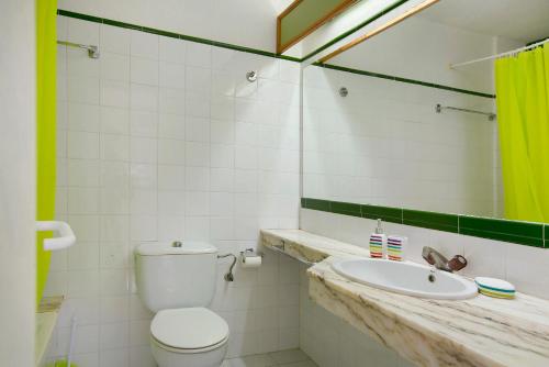 a bathroom with a toilet and a sink at Silent Flat in Puerto Rico de Gran Canaria