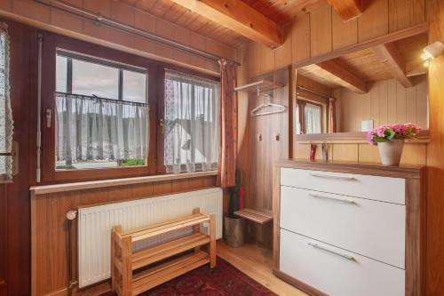 a kitchen with a window and a chest of drawers at Ferienwohnung Thelen in Wallbach