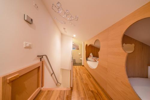 a hallway of a house with an apple sign on the wall at Sonnleiten der kleinen Bären 8 in Collepietra