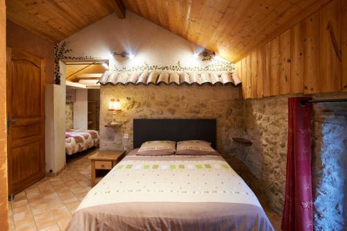 Ліжко або ліжка в номері Maison de pierre