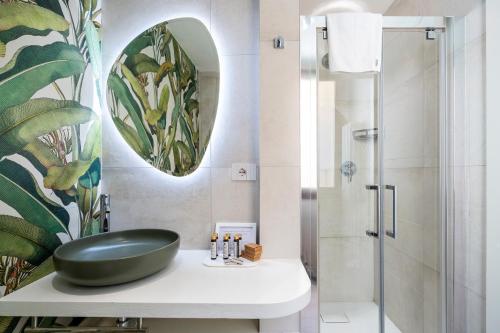 a bathroom with a black sink and a shower at La Domus Firenze in Florence