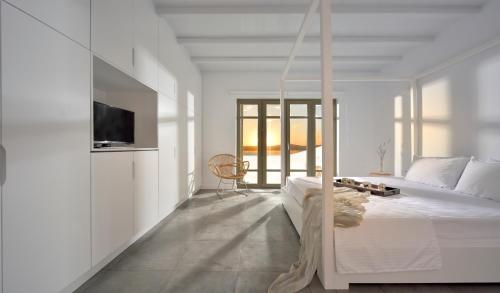 Postel nebo postele na pokoji v ubytování Mykonos Ark Villas