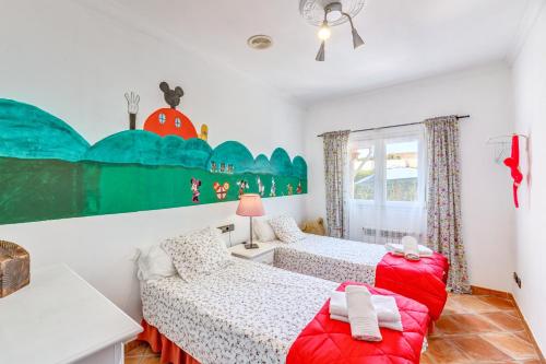 a bedroom with two beds and a couch at Dosmadres7 in Llucmajor