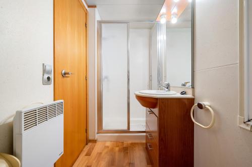 a bathroom with a sink and a mirror at La Marquesa in Camarles