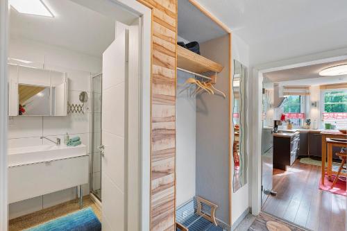a pivot door in a kitchen leading to a dining room at Haus Ruheplatzerl in Ruhpolding