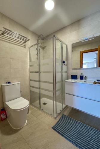 a bathroom with a shower and a toilet and a sink at Casa Blanca in Torrox Costa