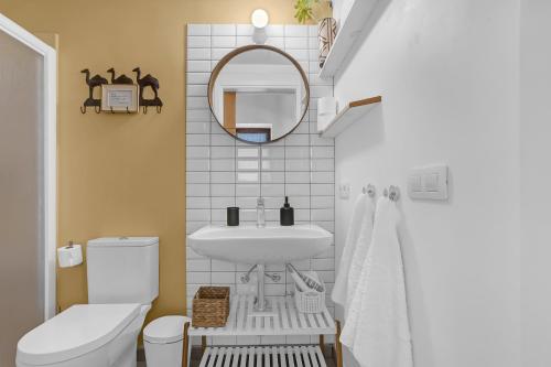 a bathroom with a sink and a mirror at Casa de Teja in La Orotava