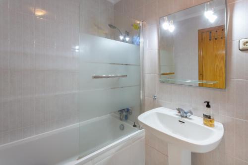 a white bathroom with a sink and a shower at Navgts5p33-1 in Torrevieja