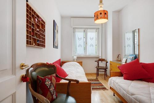 a living room with a couch and a chair at Casa Marta in Cavalese