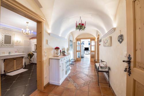 a large kitchen with a white island in a room at 5 Sterne Ferienwohnung Sissi in Übersee
