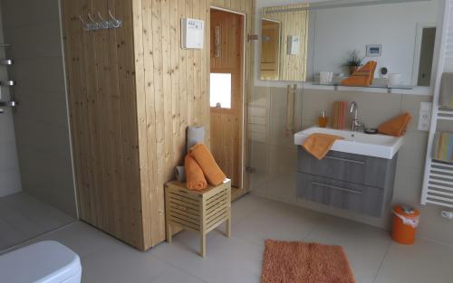 a bathroom with a sink and a toilet at Ferienhaus Olpenitz und Strand in Kappeln