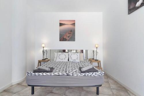 a bedroom with a bed in a white room at Apartamento Las Flores4 in San Bartolomé