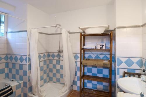 a bathroom with a shower and a sink at Casa Ginés in Iznájar