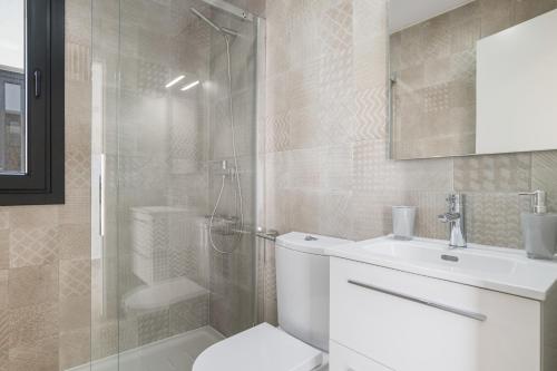 a bathroom with a shower and a toilet and a sink at Casa África in Zahara de los Atunes