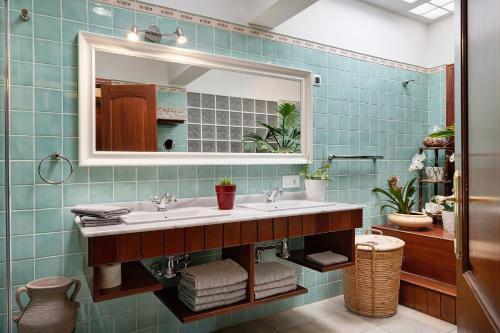 a bathroom with a sink and a mirror at Villa Fae in Playa Blanca