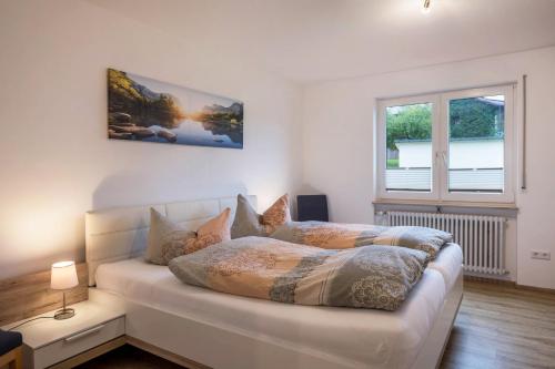 a bedroom with a bed and a window at Ferienwohnung Nr 5 Sonnenschein in Höchenschwand