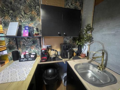 a kitchen with a sink and a counter top at Maison Donasete voyageurs in Vieille-Brioude