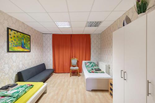 a hospital room with a couch and a bed at Ferienwohnung bei Burg Eltz in Kaisersesch