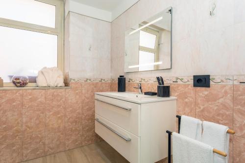 a bathroom with a sink and a mirror at MSuite Etna Sicily in Macchia