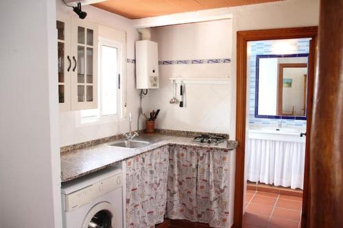 a kitchen with a sink and a counter top at Casas Pepe 5 Bungalow in Los Caños de Meca